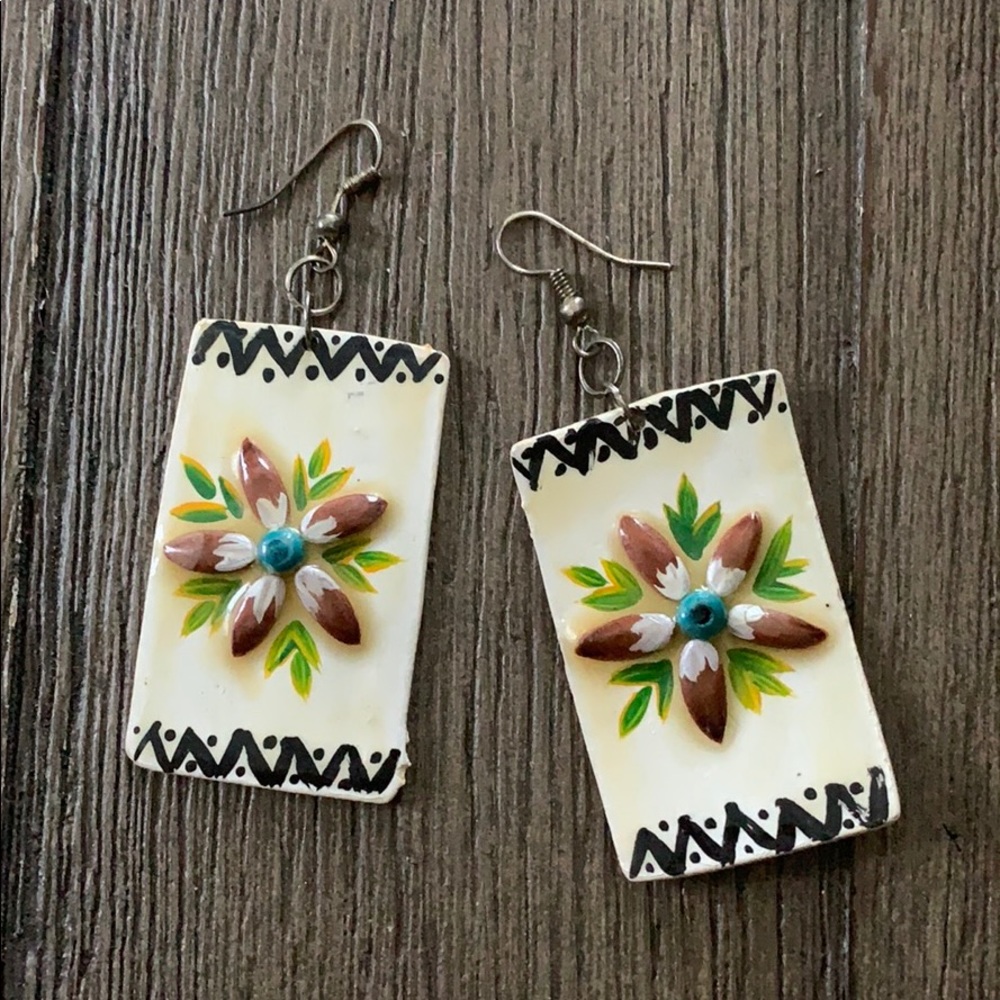 Adorable handmade earrings with flower detail!